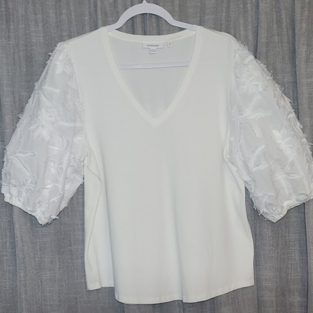 Chico's white top with distinctive embellished sleeves